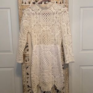 Cream colored long sleeve dress.
